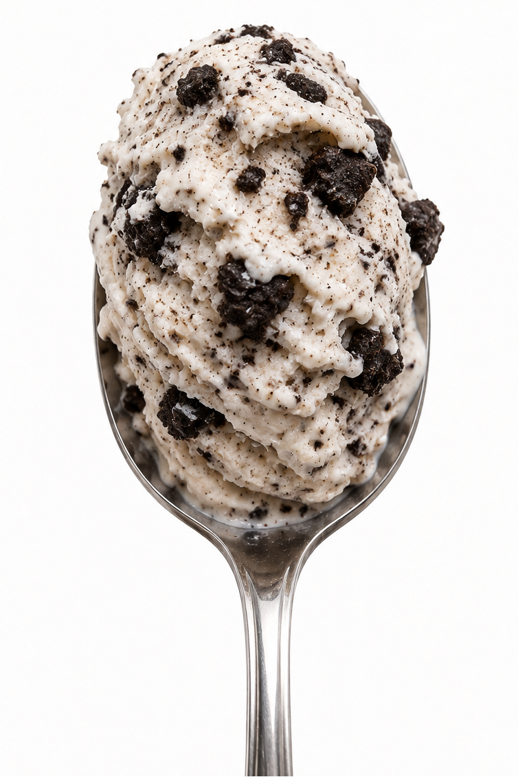 A spoonful of cream-colored ice cream  with crushed dark cookie pieces, with the brand name 'Cree' in dark blue script above on a white background.
